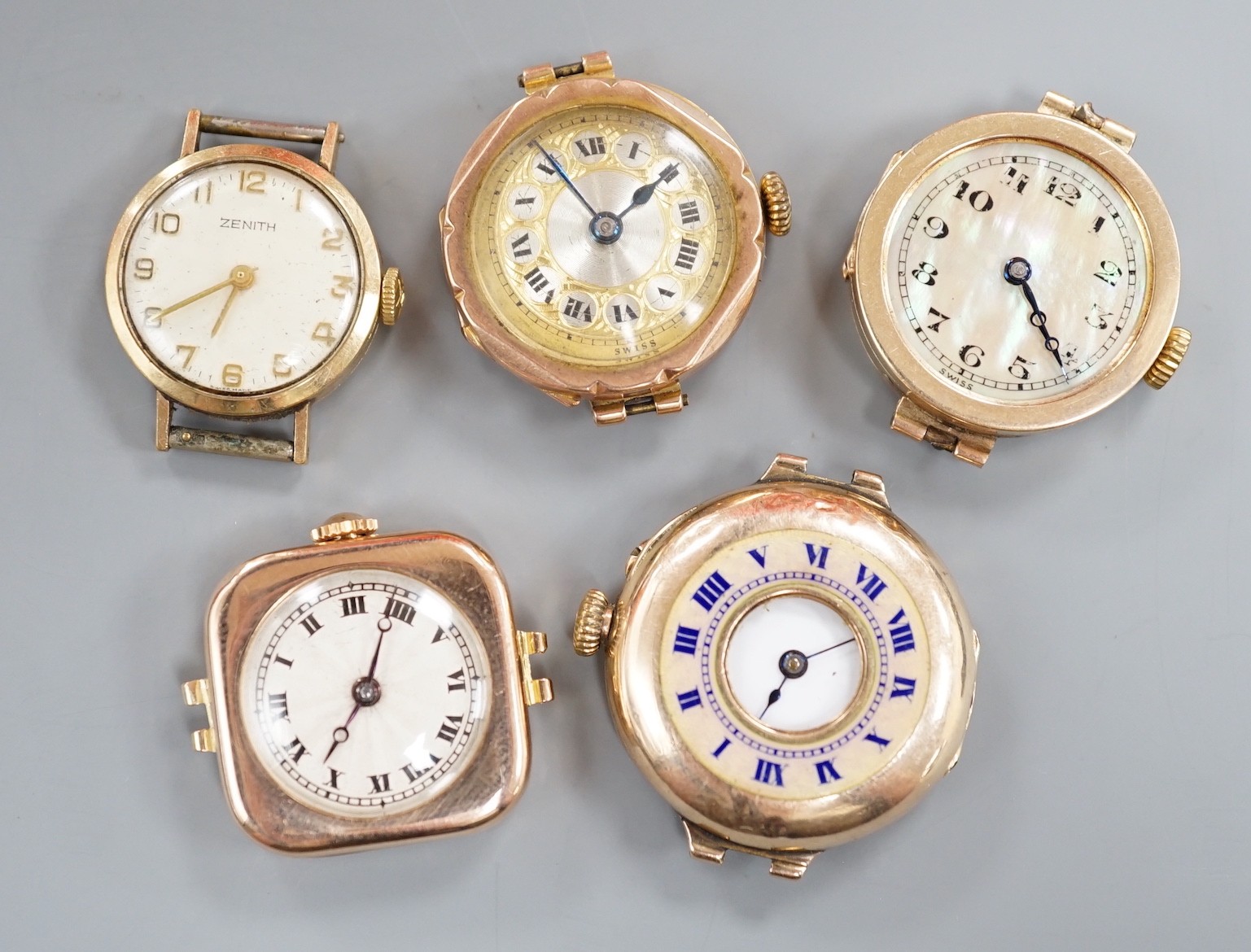 Four assorted lady's mainly early to mid 20th century 9ct gold manual wind wrist watches, including Vertex & Zenith and one other yellow metal wrist watch, all lacking straps.
